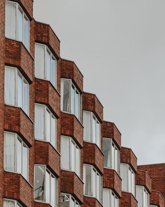 a tall brick building with lots of windows